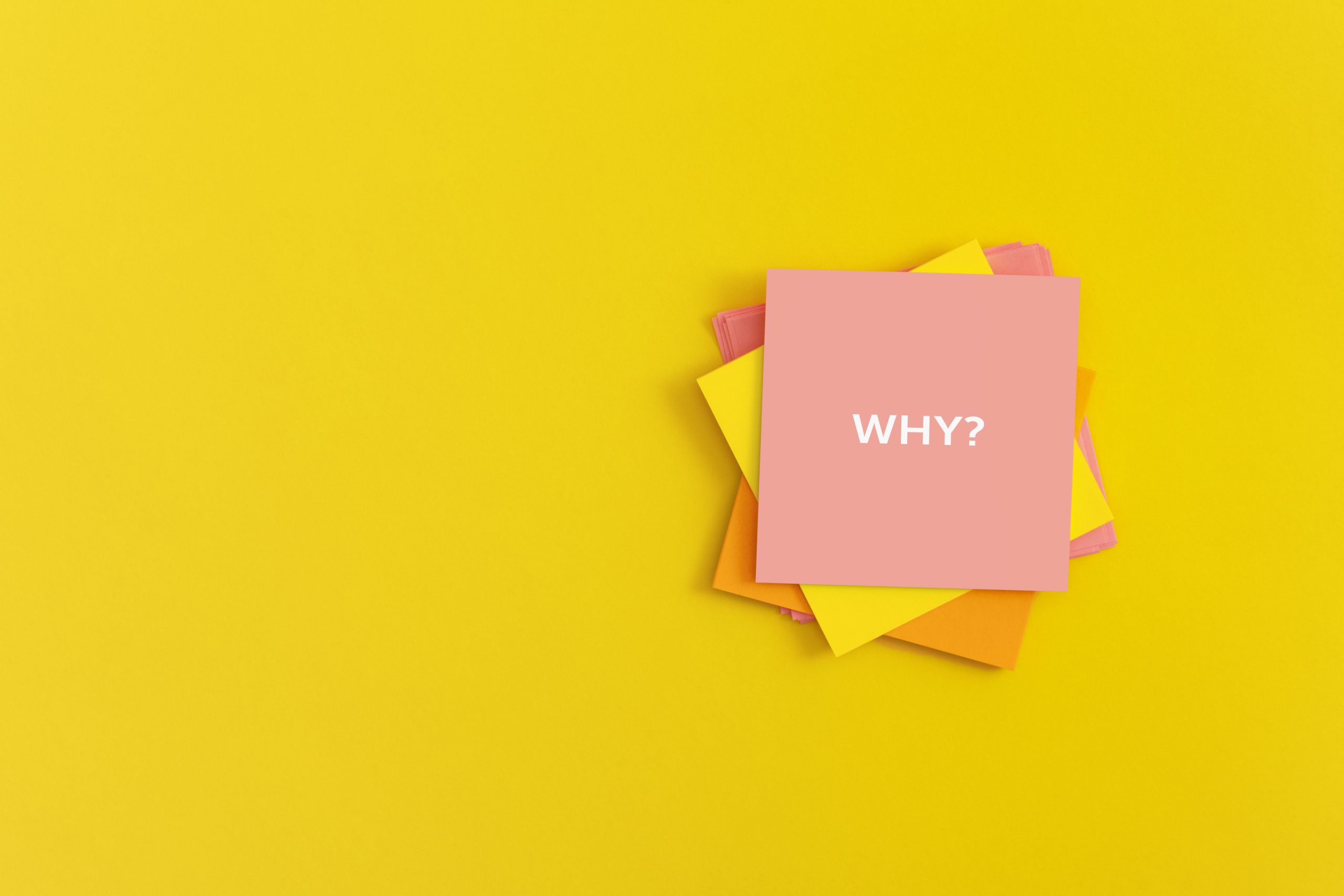 Sticky notes with word WHY